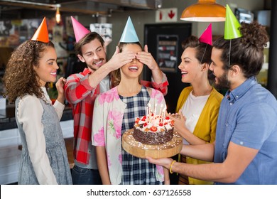 Happy Friends With Cake Giving Suprise To Woman During Her Birthday