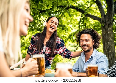 Happy Friends Celebrating Drinking Beer Pint At Park Outdoor - Young People Talking And Laughing Together At Brewery Pub Garden - Friendship, Youth And Beverage Concept