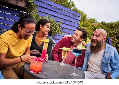 Happy Friends Celebrating Drinking Cocktails. Group Of Smiling Young People Having Fun Terrace Bar