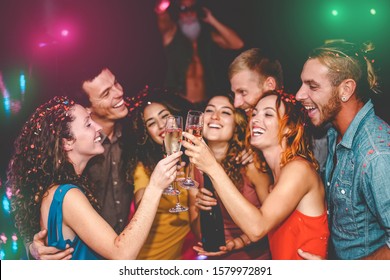 Happy Friends Celebrating New Year Eve Holidays In Disco Club - Young People Doing Private Party With Deejay And Drinking Champagne - Youth Culture Entertainment Lifestyle Concept 