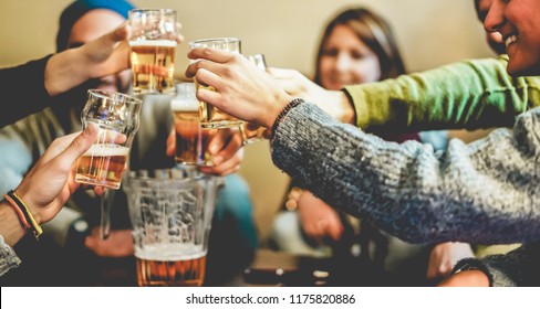 Happy Friends Cheering With Half Pints Beer In Pub Restaurant - Young People Having Fun At Chalet Bar Party - Youth, Vacation And Nightlife Lifestyle Concept - Focus On Close-up Hands