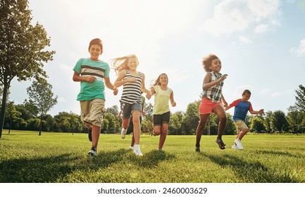 Happy friends, children and running with grass field in nature for fun, playful day or sunshine at park. Diversity or group of excited kids or youth enjoying sunny outdoor holiday or weekend together - Powered by Shutterstock