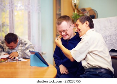happy friends with disability socializing through internet - Shutterstock ID 253283755