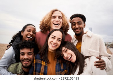 Happy friends from diverse cultures and races taking selfie outdoors. Cheerful people having fun. High quality photo - Powered by Shutterstock