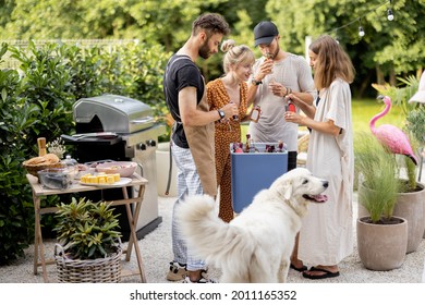 Happy Friends And Dog With Fridge Full Of Alcohol At Party Outdoors, Young People Gathering For A Picnic, Taking Alcohol Drinks At Backyard