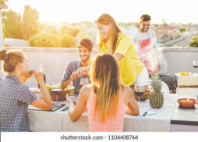 Happy Friends Doing Barbecue Dinner In Patio Terrace - Young Millennial People Having Fun At Bbq Meal Outdoor At Summer Sunset - Focus On Girls Hands - Youth Lifestyle, Friendship And Party Concept