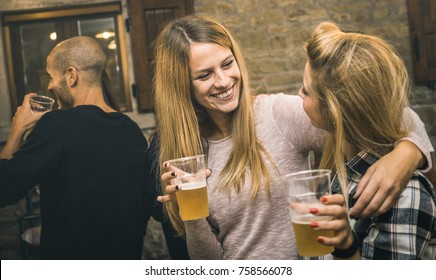 Happy Friends Drinking Beer At House Party - Friendship Concept With Fancy People Having Fun Together - Young Women Sharing Joy Moment Celebrating At Home - Warm Retro Filter With Focus On Middle Girl