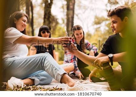Happy friends drinking mate infusion. Lifestyle concept of friends sharing a good time.