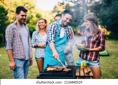 Happy Friends Enjoying Barbecue Party