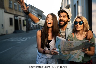 Happy friends enjoying sightseeing tour in the city