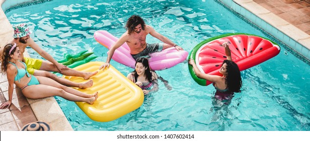 Happy Friends Floating With Air Lilo Ball At Swimming Pool Party - Young People Having Fun On Summer Holidays Vacation - Travel, Friendship, Youth And Tropical Concept - Focus On Guys Faces