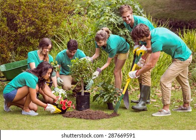 Happy Friends Gardening For The Community On A Sunny Day