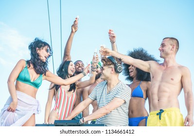 Happy Friends Having Boat Party With Dj Mixing Music Outdoor - Young Millennial People Dancing And Drinking Champagne In Sail Summer Fest - Youth And Vacation Concept - Main Focus On Center Girl Face