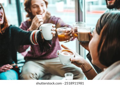 Happy friends having breakfast together at cafe bar - Group of young people drinking coffee and fresh juice sitting at brunch restaurant - Food and drink concept - Powered by Shutterstock