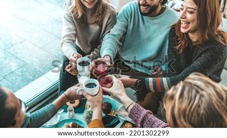 Happy friends having breakfast together at cafe bar - Group of young people drinking coffee and fresh juice sitting at brunch restaurant - Food and drink concept