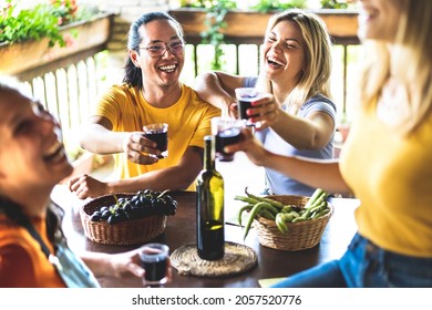 Happy Friends Having Fun Drinking At Vineyard Patio - Life Style Concept With Young People Enjoying Harvest Together At Farmhouse - Red Wine Tasting At Unique Experience Outdoor - Warm Contrast Filter