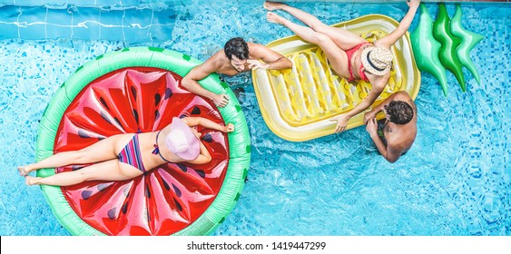 Happy Friends Having Fun Inside Swimming Pool - Young People Talking And Laughing On Summer Holidays Vacation - Travel, Holidays, Youth Lifestyle, Friendship And Tropical Concept