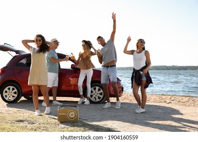 Happy Friends Having Fun Near Car On Beach. Summer Trip