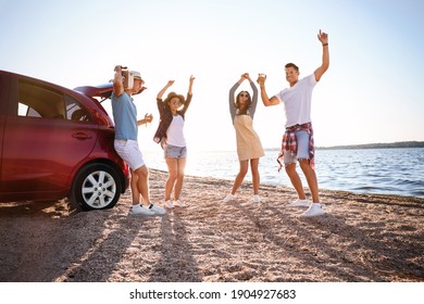 Happy Friends Having Fun Near Car On Beach. Summer Trip