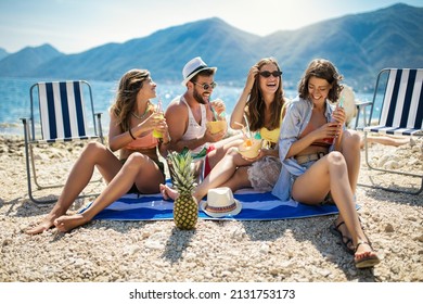 Happy friends having fun with tropical cocktails on beach party. Travel and summer vacation concept. - Shutterstock ID 2131753173