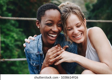 Happy friends holding each other