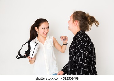 Happy Friends Holding A Head Mounted Display