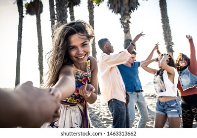 Happy friends on the beach. Making party and having fun together. Summer lifestyle concept