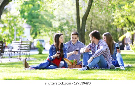 Happy Friends On Picnic In Park