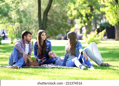 Happy Friends On Picnic In Park