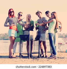 Happy Friends On Rest At Beach