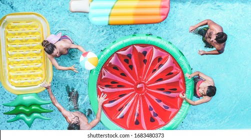 Happy Friends Playing With Air Lilo Ball Inside Swimming Pool - Young People Having Fun On Summer Holidays Vacation - Travel, Holidays, Youth Lifestyle, Friendship And Tropical Concept