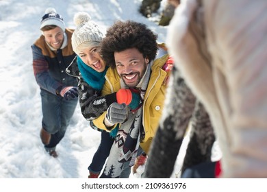 Happy Friends Playing In Snow