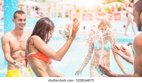 Happy Friends Playing In Swimming Pool Party - Young Diverse Culture People Having Fun On Summer Vacation - Focus On Latin Woman Face - Youth Lifestyle, Travel, Holidays And Friendship Concept