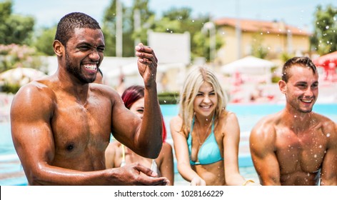 Happy Friends Playing In Swimming Pool Party - Young Diverse Culture People Having Fun On Summer Vacation - Focus On Black Man Face - Youth Lifestyle And Friendship Concept