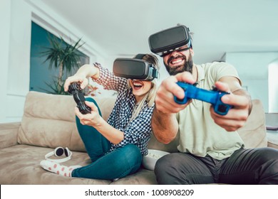 Happy Friends Playing Video Games With Virtual Reality Glasses - Young People Having Fun With New Technology Console Online