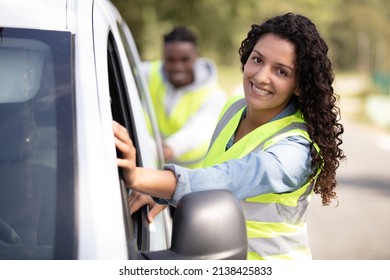 Happy Friends Pushing Broken Car