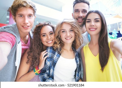 Happy friends taking selfie in cafe - Shutterstock ID 521901184