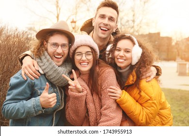 Happy friends taking selfie outdoors - Shutterstock ID 1743955913