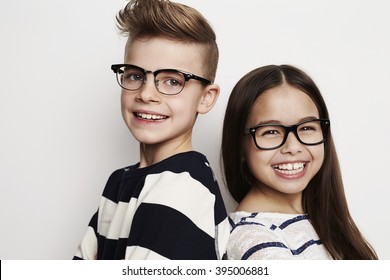 Happy Friends Wearing Glasses In Studio