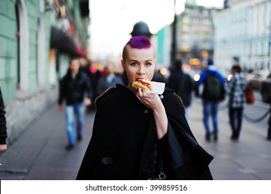 Happy Fun Beautiful Young Woman Eating A Large Huge Meat Hot Dog On The Way To The Winter City Street. Funny Fit Hipster Lady Holding Big Tasty Hotdog Bbq Sauce Enjoying Real Cool Fastfood Bread Snack