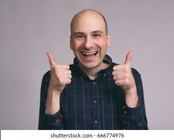 Happy Funny Bald Man Shows Sight Thumbs Up