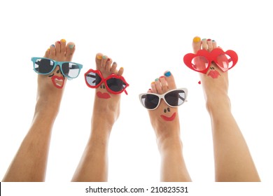 Happy And Funny Black And Caucasian Summer Feet With Colorful Nail Polish And Sunglasses