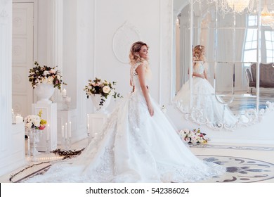 Happy and funny bride in wedding day. Luxurious light interior