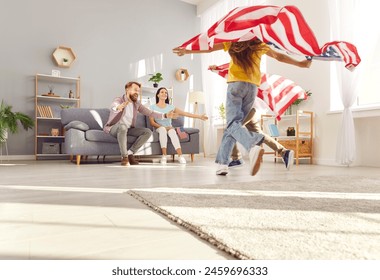 Happy funny children boy and girl having fun and running with flags of united states in living room at home celebrating Independence Day with their parents. Family patriotism and US holiday concept. - Powered by Shutterstock
