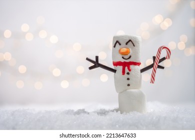 Happy funny marshmallow snowman are having fun in snow. Merry Christmas card. Christmas concept - Shutterstock ID 2213647633