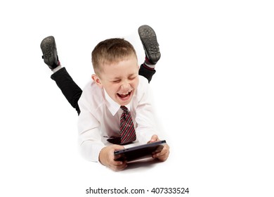 Happy And Funny School Boy Child With Tablet Pc On White Background Isolated