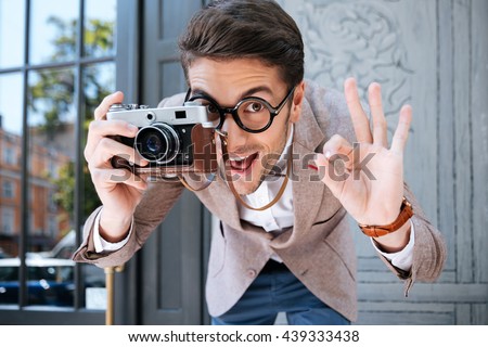 Similar – Image, Stock Photo Happy photographer is taking a photo