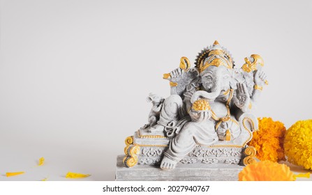 Happy Ganesh Chaturthi festival, Lord Ganesha statue with beautiful texture on white background, Ganesh is hindu god of Success.