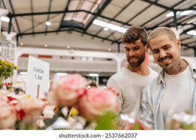 Happy gay couple choosing pink roses at a bustling flower shop, enjoying shopping together in a colorful setting. Smiling, sharing a moment of togetherness, capturing joy and love - Powered by Shutterstock