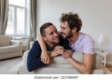 Happy Gay Couple Lying Down On The Bed At Home, Hugging And Flirting. LGBT Gay Couple Love Moments Happiness Concept